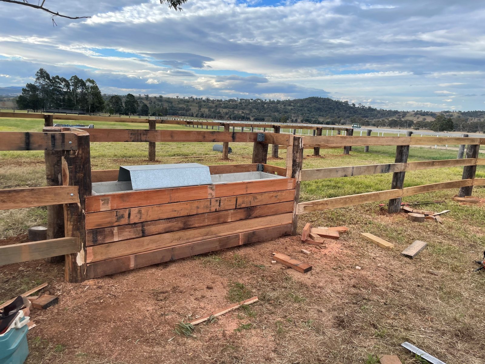 Freshly built timber post-and-rail fencing and feed trough at Coolmore, Jerry's Plains